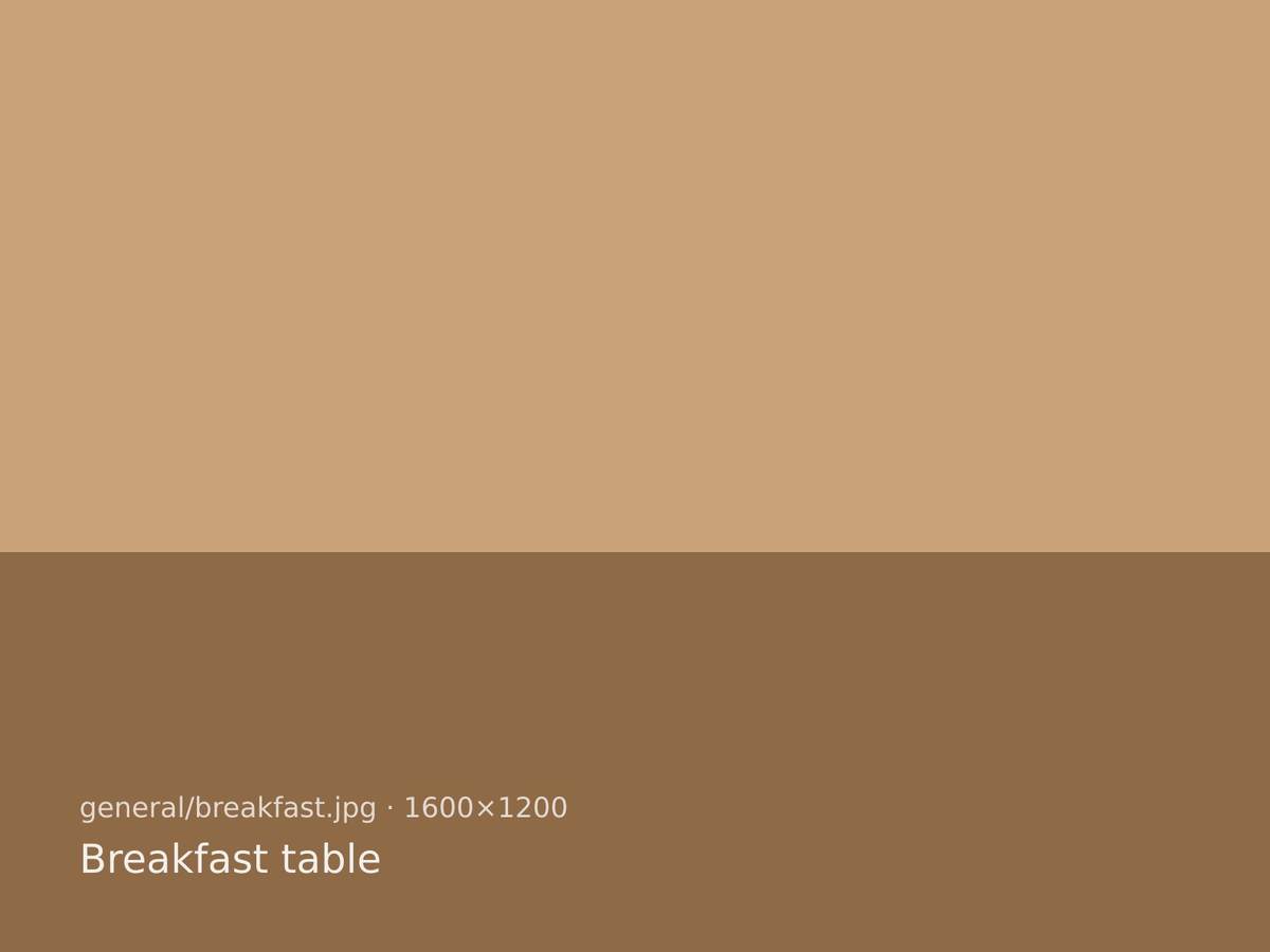 Brown bread, butter and a pot of tea on the kitchen table