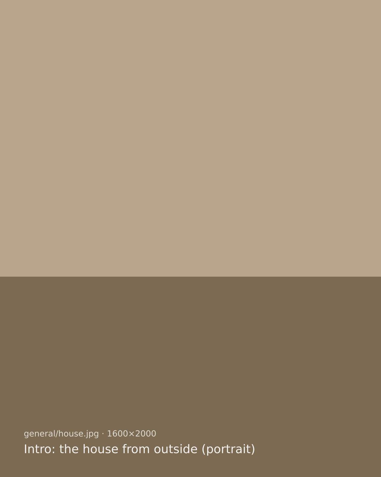 The front of Saltgrass House, a white two-storey farmhouse with a rust-red door